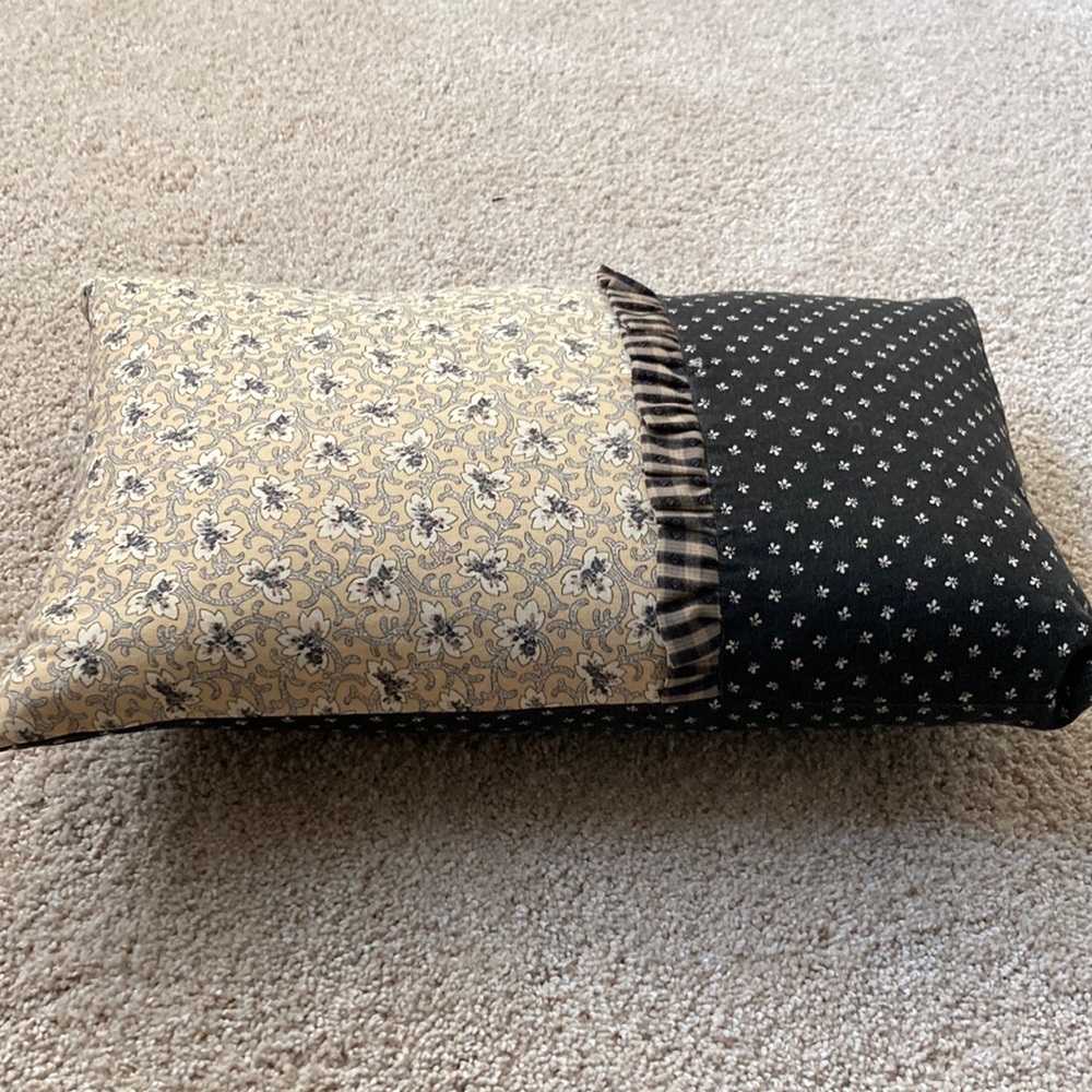 Decorative pillows (2), black and tan.